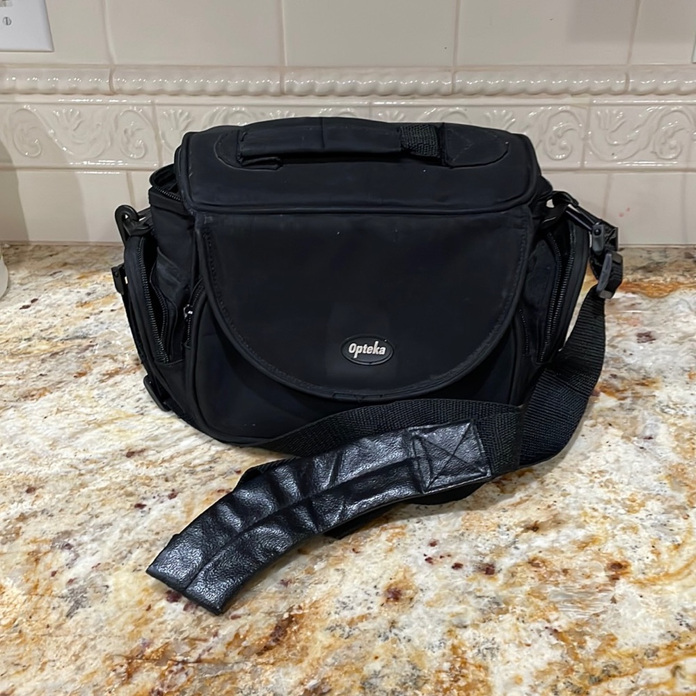 NWOT never used in original bag. OPTEKA camera case